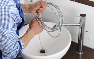 plumber cleaning out clogged sink drain clarksville tn